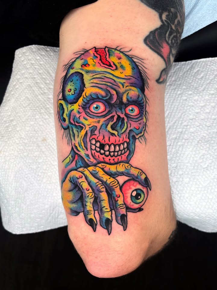 Neon zombie holding eyeball tattoo