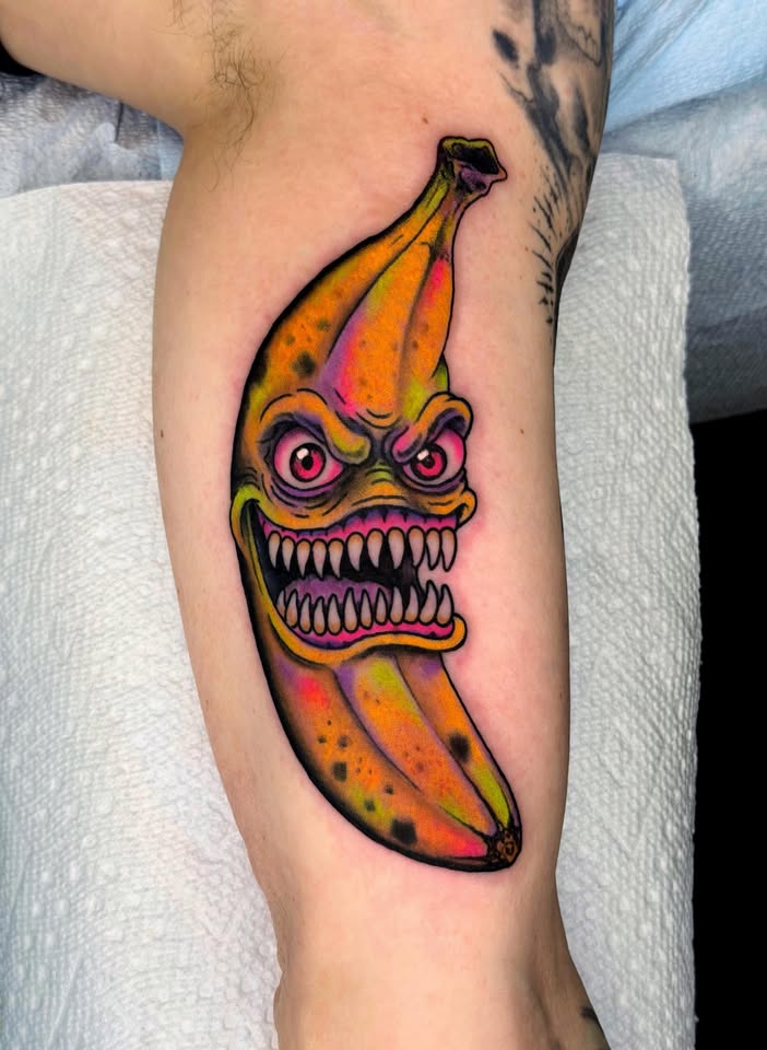 Evil banana with teeth tattoo
