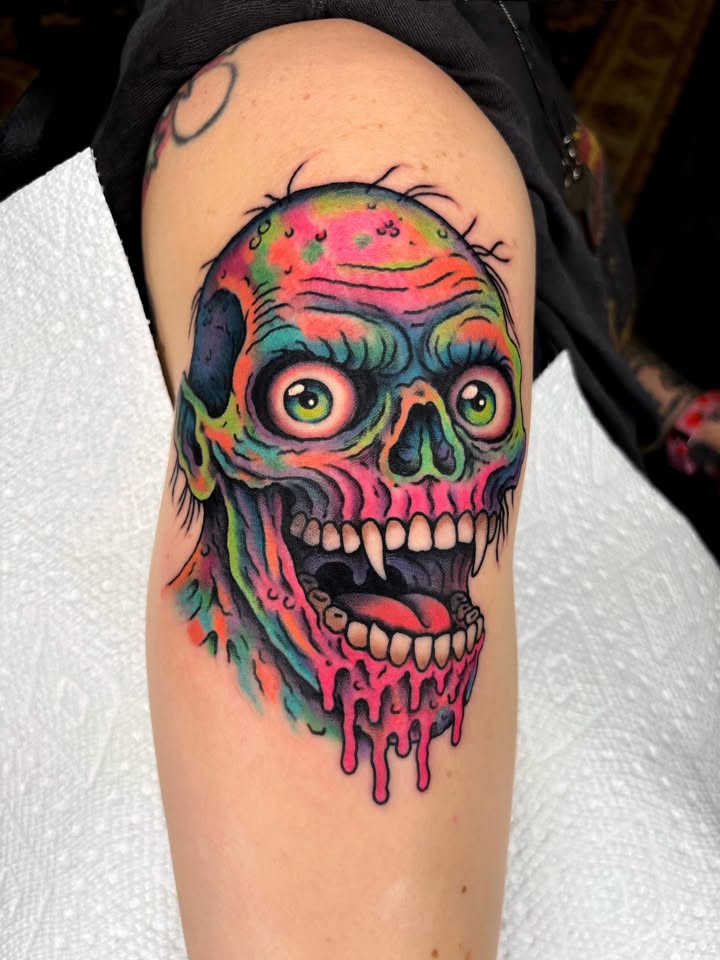 Neon dripping zombie skull tattoo with fangs