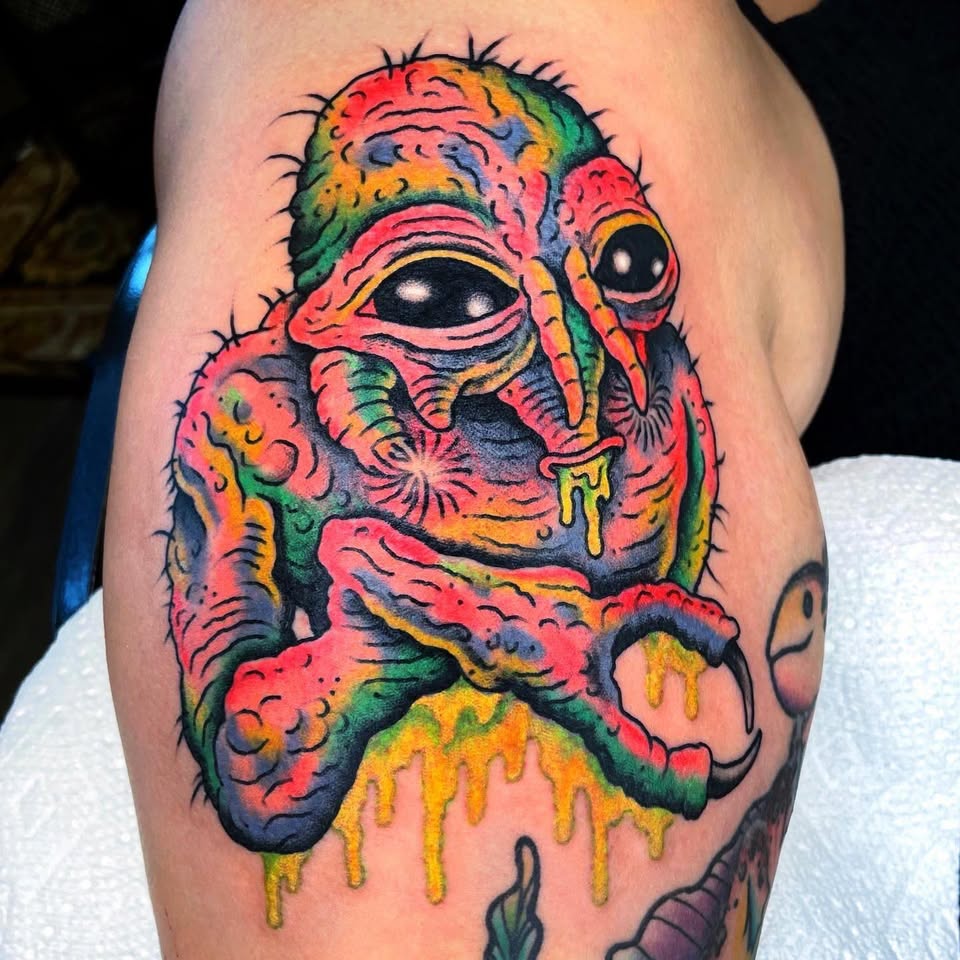 Psychedelic alien creature tattoo