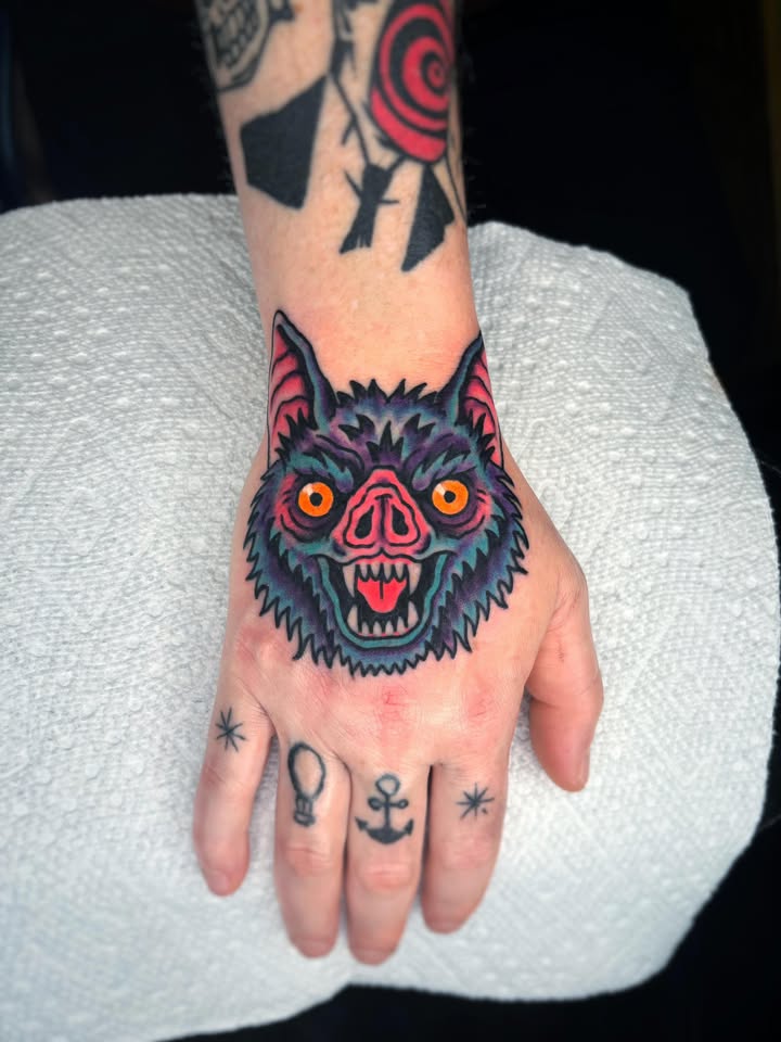 Neon bat hand tattoo