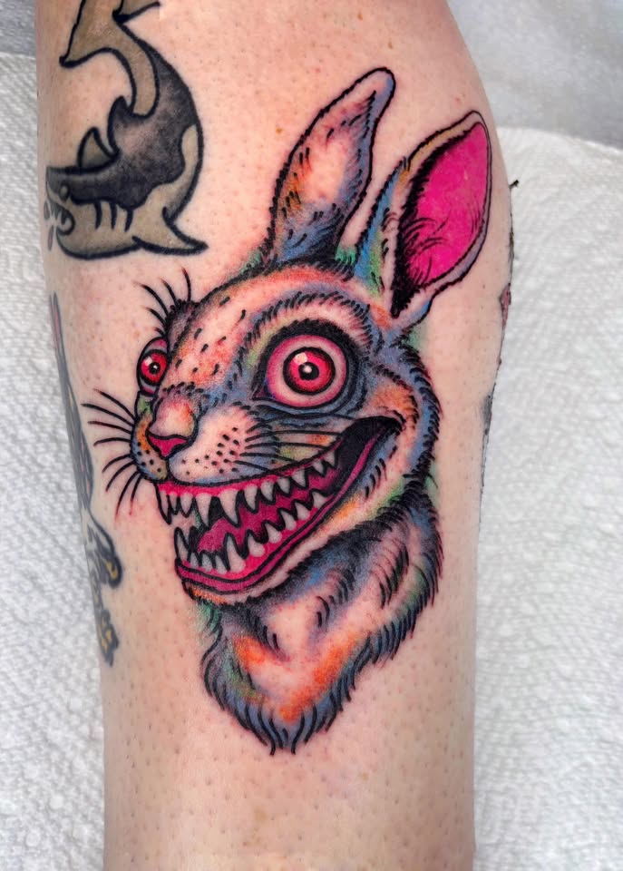 Creepy toothy rabbit tattoo